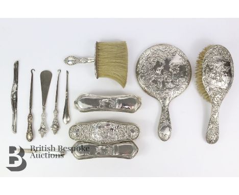 Set of silver vanity accessories, including two hairbrushes, clothes brush, hand mirror, shoe horn and button hook Birmingham