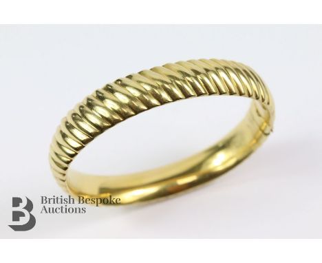 18ct yellow gold bangle, stamped 750, measures 60 x 50 mm, 30.3 gms.&nbsp;