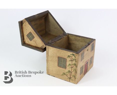 A folk art wooden tea caddy in the form of a cottage, approx 16 x 14 x 20 cms.&nbsp;