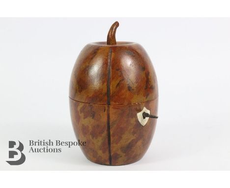 A charming fruitwood tea caddy in the form of a segmented fruit, approx 16 cms h.&nbsp;