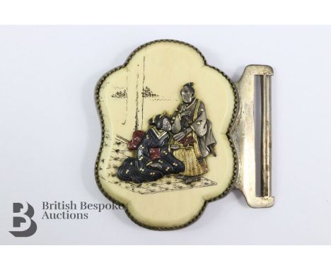 Japanese ivory belt buckle, worked in silver, enamel and silver-gilt, depicting figures in elaborate robes, approx 6 x 6 cms.