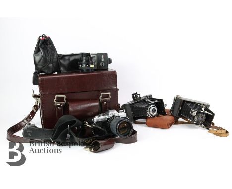 Collection of cameras, including a Zeiss Ikon Vario folding camera 1:6,3 f=105mm Novar-Anastigmat lens, a Kodak Kodex No.1 Po