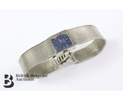 Lady's 9ct white gold Rotary wrist watch. The watch having a blue face with baton dial. Approx. 22.9 gms.