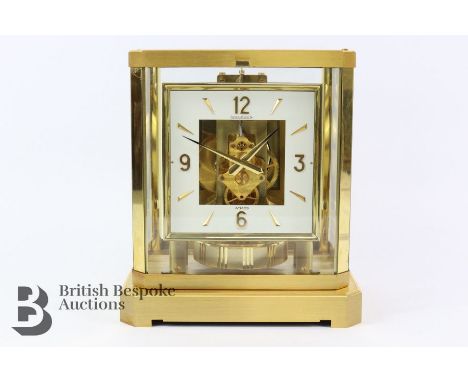 Jaeger-Le-Coultre gilt brass Atmos Perpetuelle mantel clock, raised on a gilt brass base, with glass panels on four sides to 