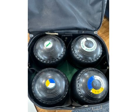 Set of four vintage lawn bowls with a Dawn De luxe bag 