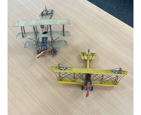 Two vintage metal planes largest measures approx 6 inches tall by 14 inches long
