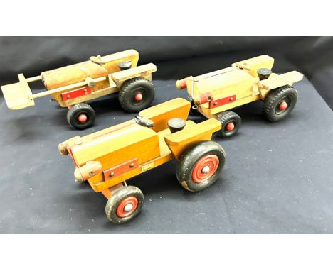 Three child vintage wooden tractors largest measures 11 inches long