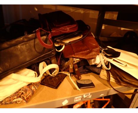 Shelf of mixed ladies handbags