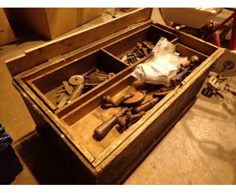 Old tool box containing a selection of vintage tools