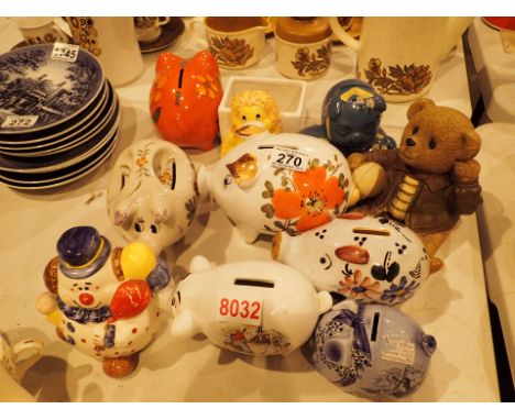 Collection of ceramic piggy banks and other savings banks