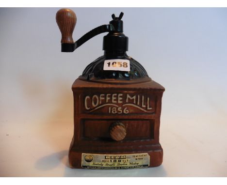 A 1979 James Beam Kentucky straight Bourbon whiskey novety decanter in the form of a coffee grinder 75cl/25.4 floz 80% proof