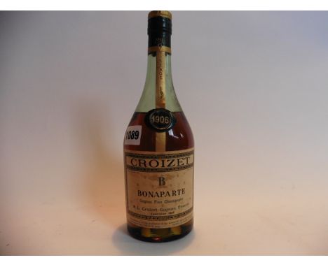 A bottle of Croizet Bonaparte Cognac fine champagne vintage 1906 and bottled in the 1950's 70% proof no size stated but estim