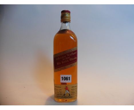 An 1970s bottle of Johnnie Walker Red Label old Scotch Whisky 26 2/3 floz 70% proof