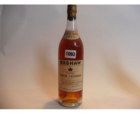 An old bottle of John Exshaw Grande Champagne Cognac Vintage 1935 specially bottled for Grosvenor House 70% proof no size sta