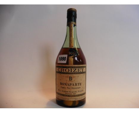 A bottle of Croizet Bonaparte Cognac fine champagne vintage 1906 and bottled in the 1950's 70% proof no size stated but estim