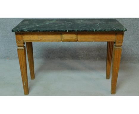 A late 19th century oak marble topped console table raised on fluted square tapering supports. H.76 W.107 D.48cm 