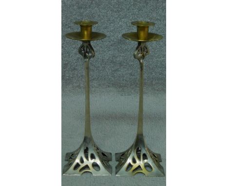 A pair of vintage Art Nouveau style metal candle sticks. H.37cm 