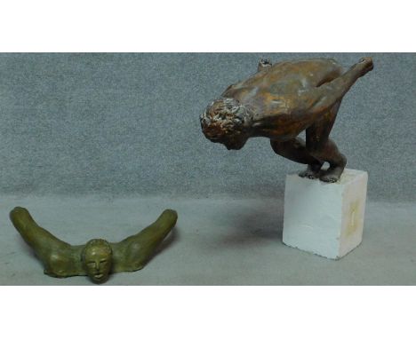 Two vintage fibre glass bonze effect sculptures of swimmers. H.59cm 