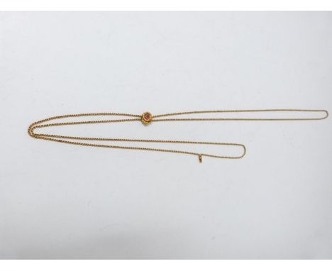 An antique yellow metal sliding rope fob chain, with a sliding bead carved in the form of a daisy with a leaf set to the cent