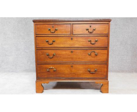 A Georgian mahogany chest of two short over three long drawers on bracket feet. H.94 W.95 D.57cm 