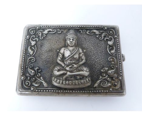 A vintage oriental silver cigarette case with Buddha and Thai demon relief design. Push catch stamped S800. Weight 125g. 