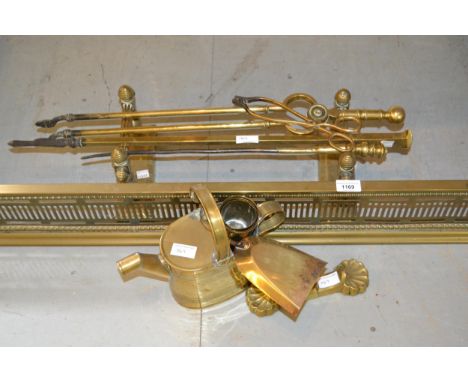 Edwardian brass fireplace fender, pair of fire dogs and miscellaneous brass fire tools 