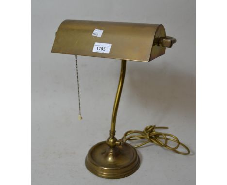 Brass adjustable desk lamp with brass shade, together with a moulded glass table lamp with shade 