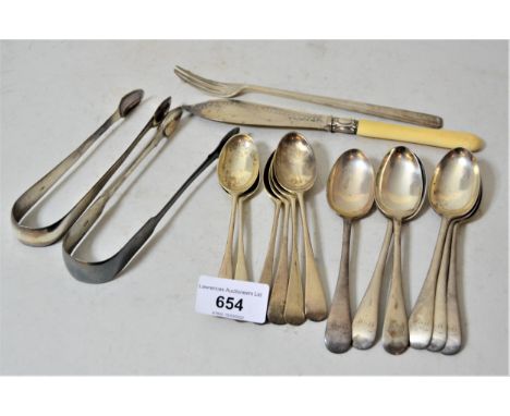 Two sets of six silver Old English pattern teaspoons, two pairs of silver sugar tongs, pickle fork and a butter knife with bo