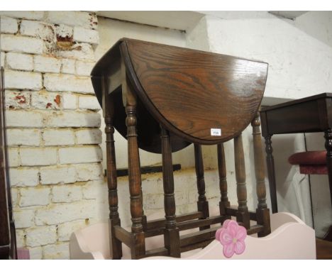 Small reproduction oak gateleg table on turned supports, reproduction bureau with linen fold panel front and an oak two tier 