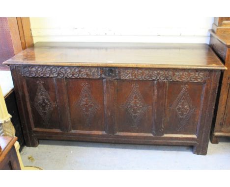 Large 17th Century oak coffer, the hinged moulded lid above a carved frieze with the initials ' I.B ' and date ' 1684 ', the 