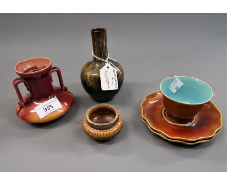 Small Linthorpe pottery two handled vase, similar baluster vase with narrow neck, a cup, two saucers and a miniature bowl wit