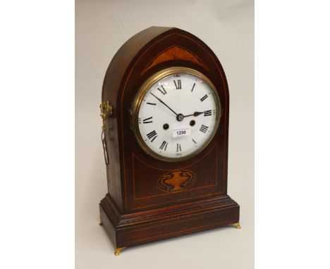 Edwardian mahogany and marquetry inlaid lancet shaped mantel clock, the circular dial with Roman numerals, the two train move