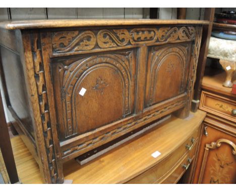 Good quality reproduction oak side cabinet in the form of a coffer with a moulded plank top, the two panel front with two con