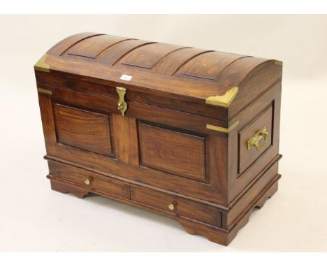 Hardwood brass inlaid and brass mounted dome top trunk the three panel top and two panel front with brass clasp and two short