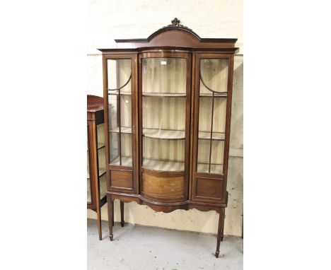 Edwardian mahogany and inlaid semi bow front display cabinet, the shaped back above a bow glazed centre panel flanked by two 