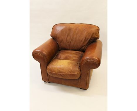 Pair of light tan leather upholstered club style armchairs, with loose cushions on low supportsBoth in good condition, no tea