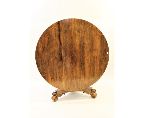 William IV rosewood centre table, the circular tilt top above a turned and tulip carved column support, the triform base with