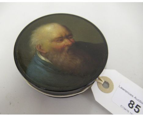 Small 19th Century black lacquer papier mache circular snuff box, the lid painted with a portrait of a bearded man wearing a 