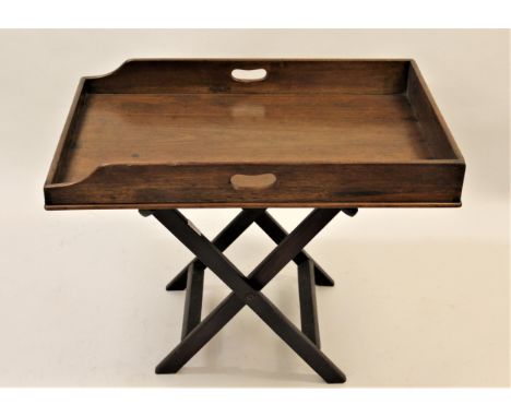 19th Century mahogany butler's tray on a folding stand, together with a small folding luggage stand and a vintage suitcase 