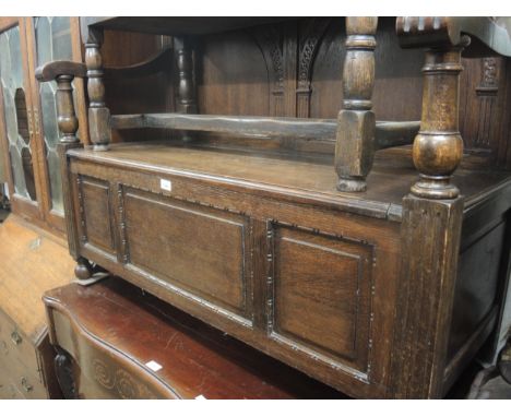 Late 19th / early 20th Century oak hall bench with an arcaded panel back above a three panel box seat, 47.5ins wide 