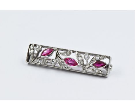 Art Deco white metal diamond and pink ruby panel brooch of pierced floral design, 40mm x 10mm approximately 