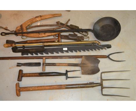 Iron spit jack, a large wrought iron ladle and miscellaneous iron agricultural tools 