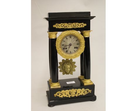 19th Century French ebonised and ormolu mounted portico clock, with a two train movement striking on a bell, (movement for at