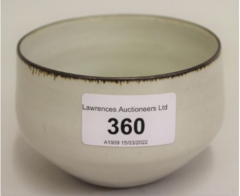 Small Lucie Rie bowl, cream glazed interior and exterior with brown slip rim, 3.5ins diameter, marked LR in relief to the bas