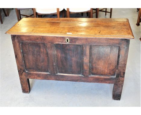 Small 17th Century oak coffer, the hinged plank top above a three panel front on stile supports, 40ins wide (repairs) 