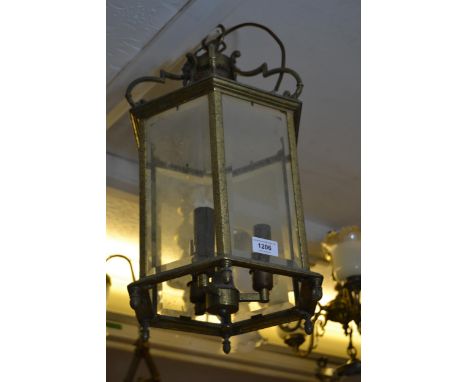 Late 20th Century brass hexagonal three light hall lantern, with bevelled glass panels (at fault) 21ins high 