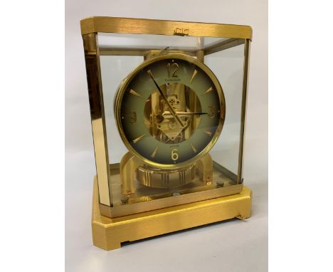 Jaeger-LeCoultre Atmos, gilt brass and glazed library clock, circular two-colour dial with Arabic numerals, 9.25ins high 