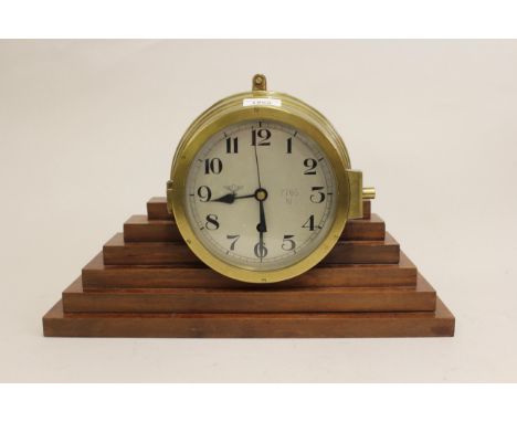 World War II German Kriegsmarine brass cased U- boat bulkhead clock, the 6.25ins dial with Arabic numerals, Third Reich emble