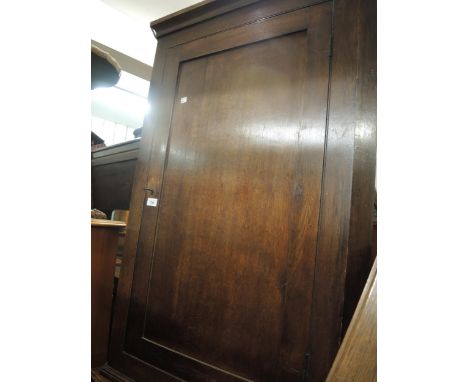 George III oak hanging corner cabinet with a single panel door, 29ins wide together with a mahogany hanging corner cabinet wi