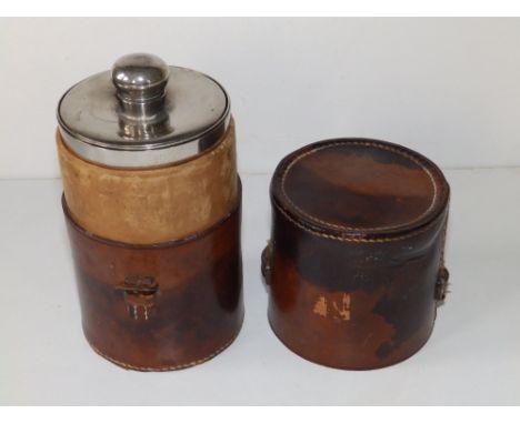 A leather cased EP hunting flask with two fitted goblets, the case 6.8" high.